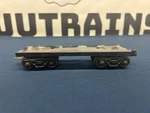 Lionel Postwar Black Tender Frame W/ Plastic Trucks. Fixed Price $9.99.