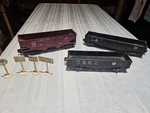 Lionel Postwar Rolling Stock 2452-6462-6456 And Four Railroad Signs 1950S. Fixed Price $42.00.