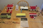 Plasticville Master Village #5900-998; 7 Buildings, 2 Cars, Fire Trks & More. Fixed Price $55.00.