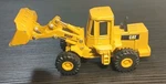Ertl Caterpillar - 950F Wheel Loader 1:64 Scale Diecast Lionel Flatcar Vtg. Fixed Price $19.00.