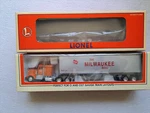 Lionel 6-52116 Milwaukee Road Flat Car With Tractor Trailer. Fixed Price $84.88.