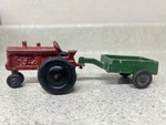 Vintage Die Cast Lee Toys International Red Tractor With Green Trailer 7". Fixed Price $10.00.