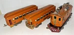 Lionel Prewar Gauge 256 Twin Motor Electric Loco & Two Passenger Cars. Fixed Price $750.00.