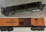 2 Lionel Cars Tiltbed #3461 , X-6034 Baby Ruth Candy. Fixed Price $22.99.