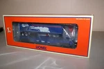 New In Box Lionel Carail Flat W/trailer 52168. Fixed Price $55.00.