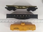 Lionel 9325 5A Flat Car Plus Freight Parts. Fixed Price $5.00.