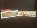 New In Box Lionel Carail Tractor And Trailer Combo 6-52069. Fixed Price $72.00.