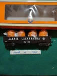 Lionel #6-26649 Erie Lackawanna Gondola With Canisters. Fixed Price $39.00.
