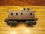 Lionel 6167-E Dark Brown Caboose 1963-64. Fixed Price $390.00.