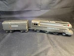 Lionel 1688E, Steamline Torpedo Gunmetal Locomotive And Whistle Tender. Fixed Price $135.00.