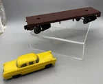 Lionel Postwar - 6404 Brown Flat Train Car With Yellow Scale. Fixed Price $79.99.